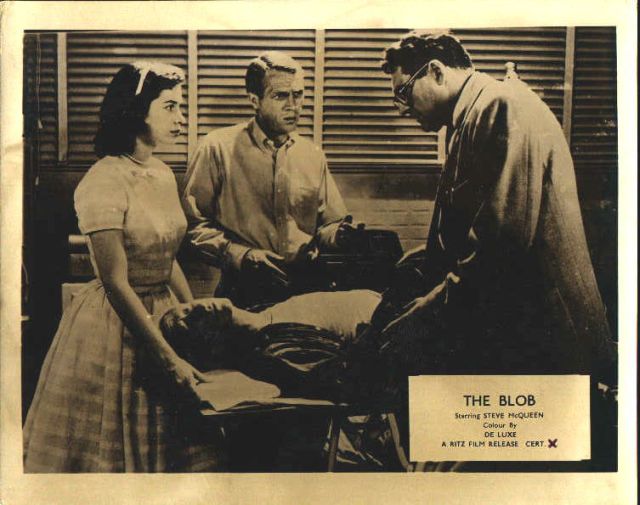 Aneta Corseaut, Steve McQueen and 
Alden Chase (as the doctor) 
looking over Olin Howland (as the patient).